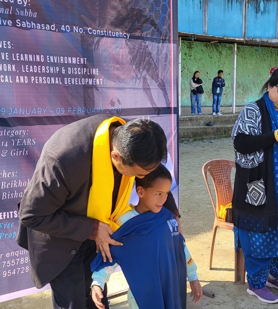 Child receiving training camp jersey