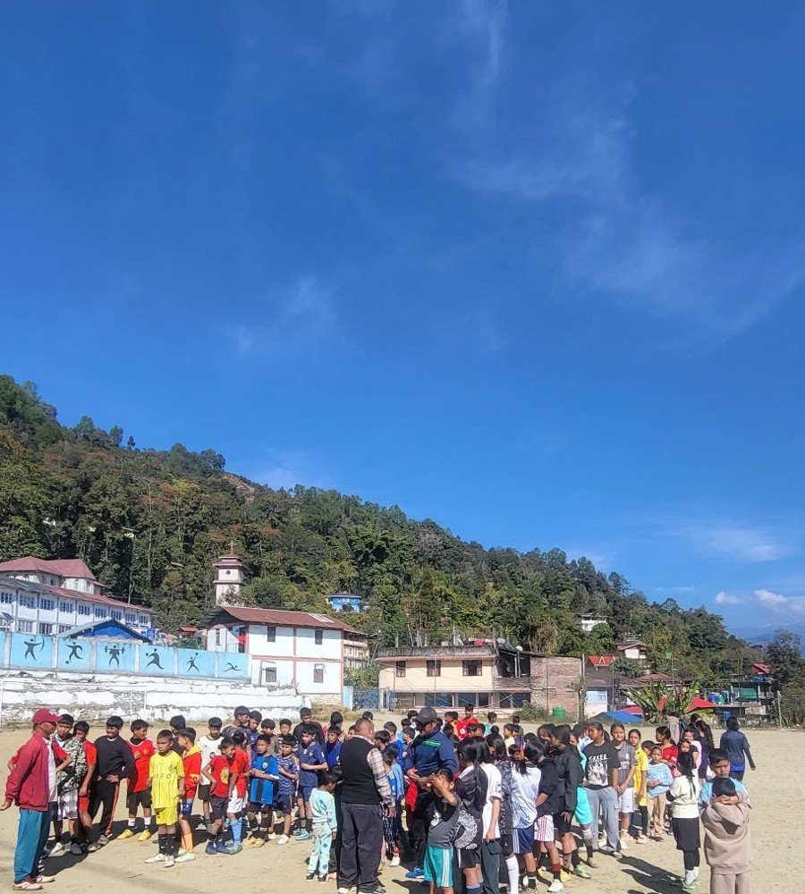 Training camp participants gathered on the ground